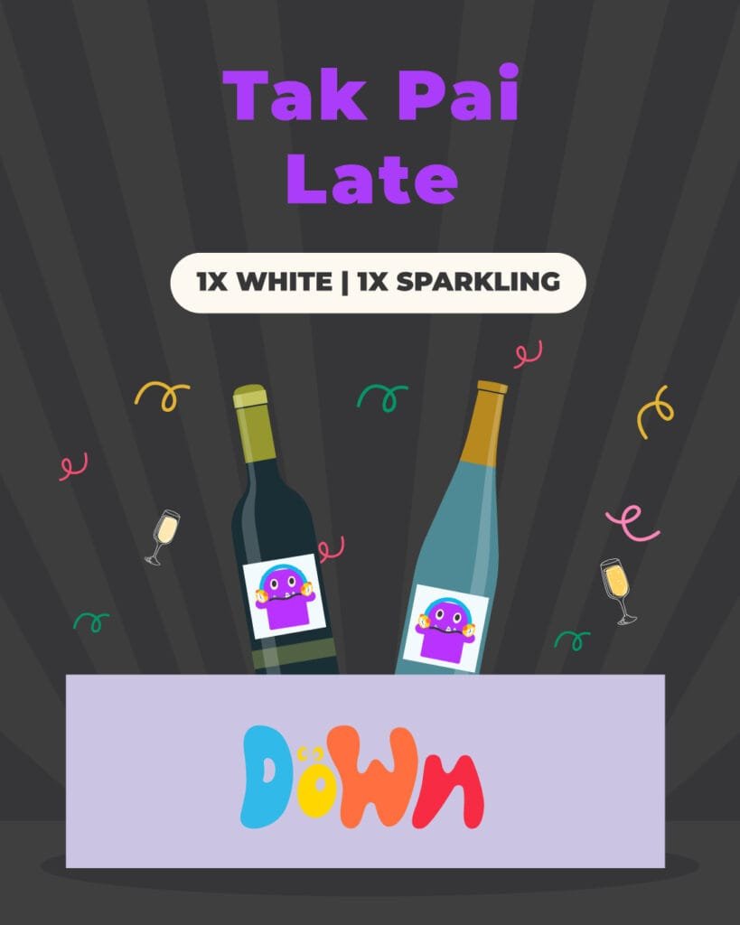 Two wine bottles, one white and one sparkling, in a Down box with confetti and the words &ldquo;Tak Pai Late.&rdquo;